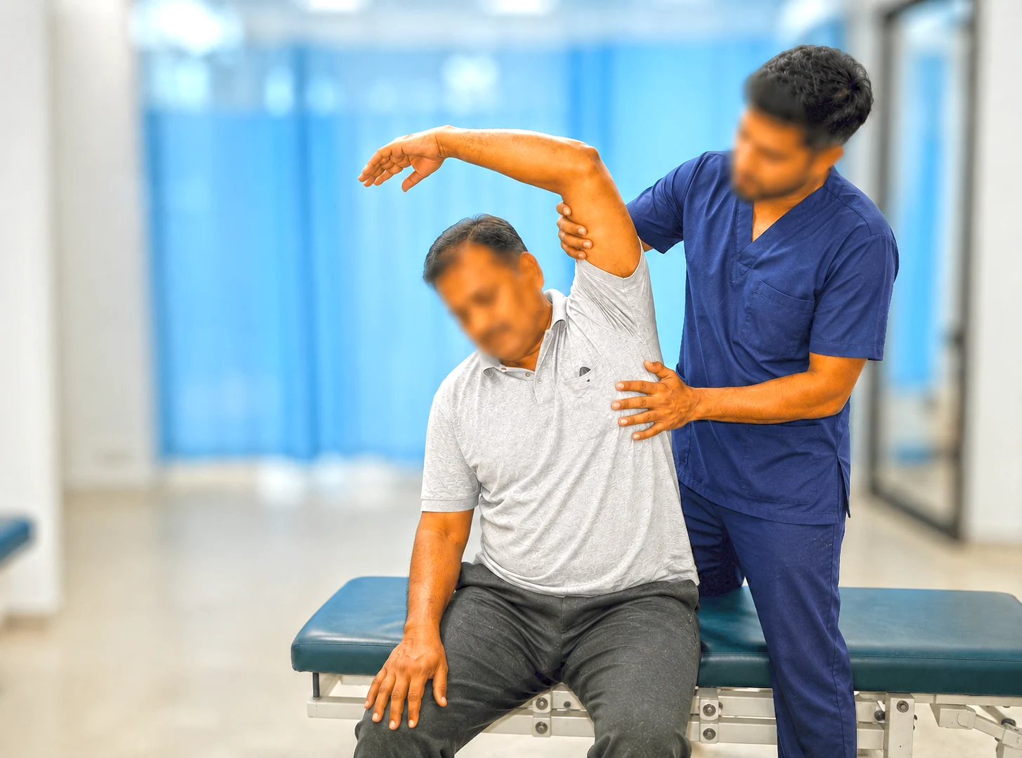 A Royal Multi Care physiotherapist guiding a patient's shoulder movement